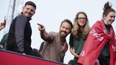 Wrexham co-owner Ryan Reynolds, center, celebrates with members of the Wrexham FC soccer team the promotion to the Football League in Wrexham, Wales, on May 2, 2023. Photo / AP 