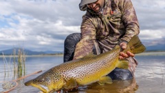 Dion James' winning fishing photo which appeared on DOC fisheries Licences for 2023. Photo / Supplied