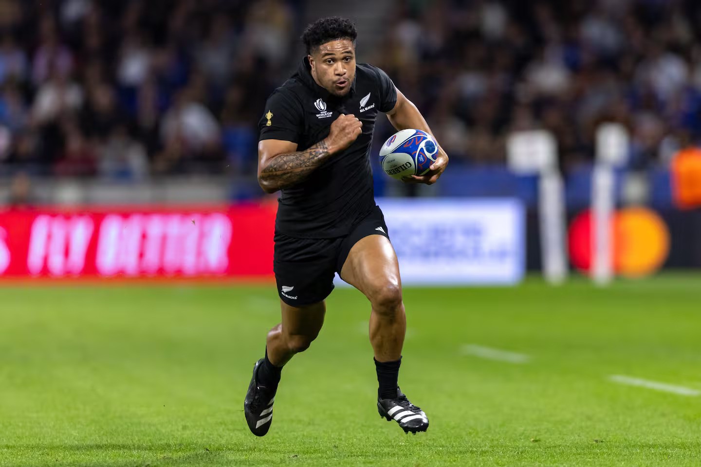 All Blacks winger Leicester Fainga'anuku makes a break at the 2023 Rugby World Cup. Photo / SmartFrame