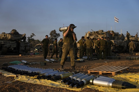 Israeli Soldiers Load Shells Onto A Tank At A Staging Area In Southern Israel Near The Border With Gaza On Sunday, Dec 31 2023. Photo / AP