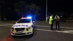 Police in Mt Wellington last night, where a man was found with a gunshot wound in one of his arms. (Photo / Hayden Woodward)