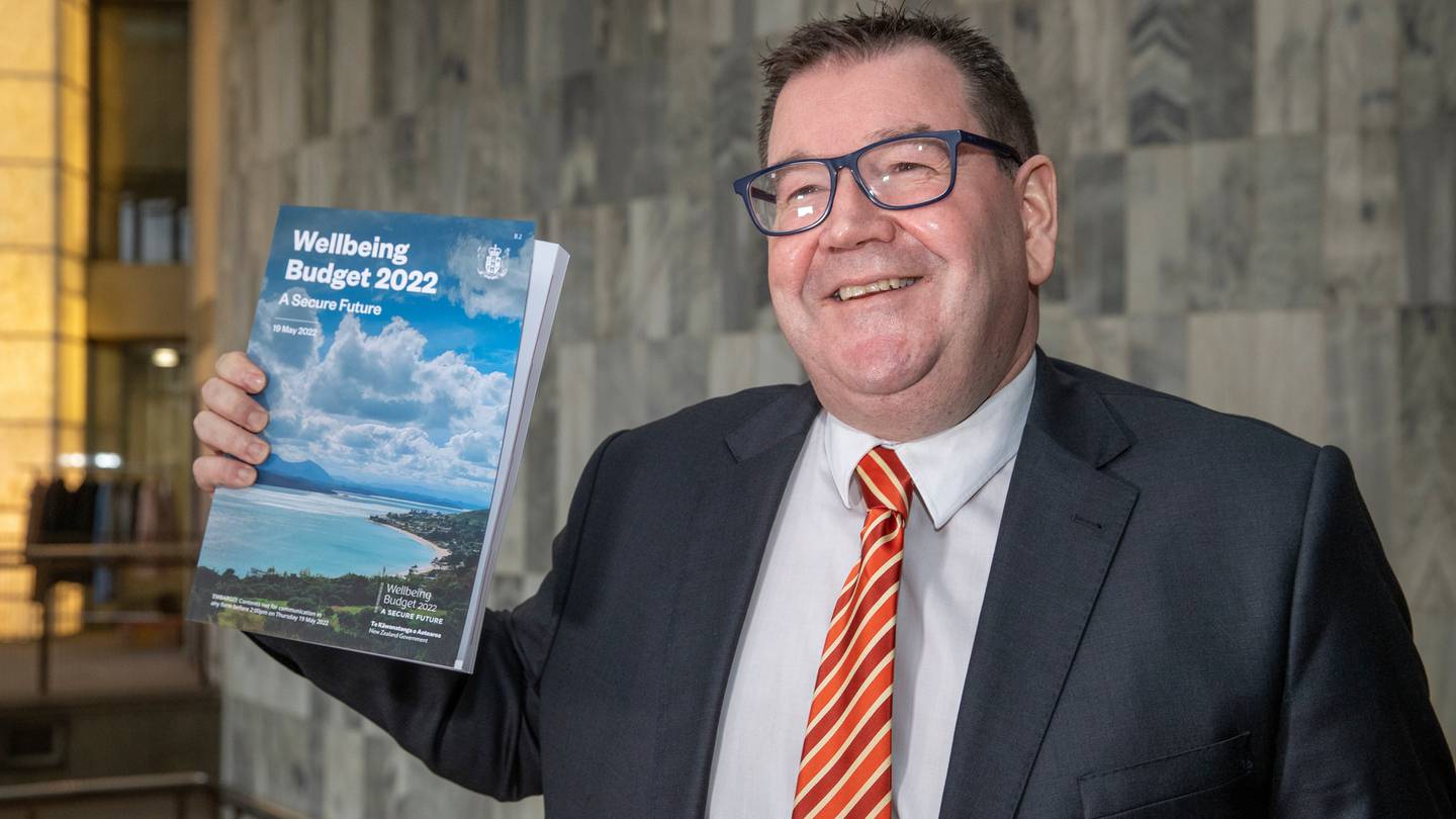Finance Minister Grant Robertson with a copy of his Wellbeing Budget 2022 at Parliament, Wellington. Photo / Mark Mitchell
