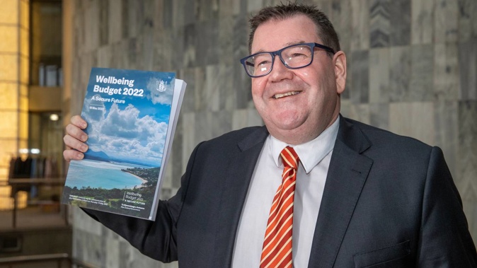 Finance Minister Grant Robertson with a copy of his Wellbeing Budget 2022 at Parliament, Wellington. Photo / Mark Mitchell