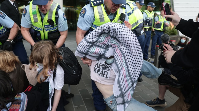 More than 100 activists have shut down Te Pae Convention Centre in Christchurch, where New Zealand’s largest aerospace conference is being held. Photo / George Heard