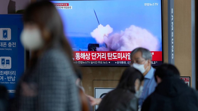A TV screen showing a news programme reporting about North Korea's missile launch with file footage, is seen at the Seoul Railway Station in Seoul, South Korea. Photo / AP