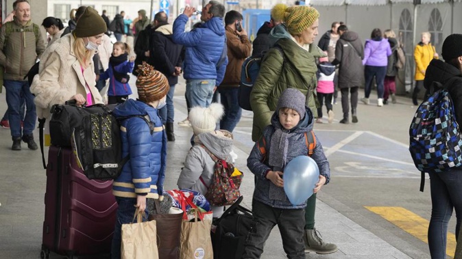 Ukrainian refugees wait for transport at the central train station in Warsaw, Poland. Photo / AP