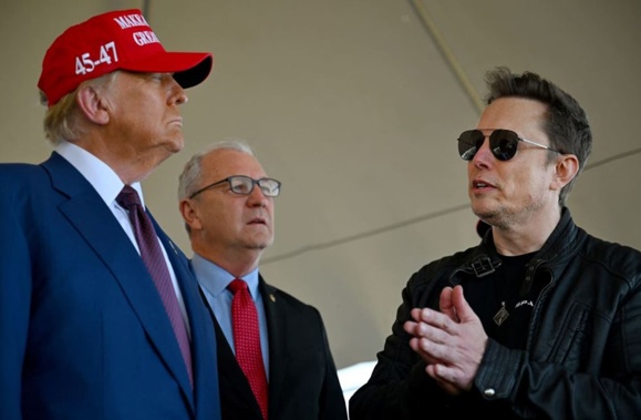 President-elect Donald Trump speaks alongside Elon Musk and Senate members before attending a viewing of the launch of the sixth test flight of the SpaceX Starship rocket on November 19. Photo / AFP