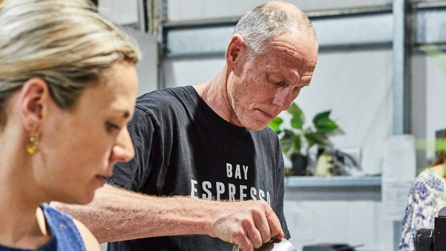 Rory Aroa's partner Bex Howie (left) helps Chris Jarvis brew coffee for customers at Bay Espresso in Hastings as part of the Roast-a-thon for Rory. Photo / Charlotte Anderson Photography