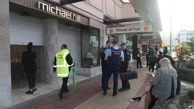The offenders were seen driving onto the footpath and entering the store dressed in black with weapons. Photo / Michael Cunningham