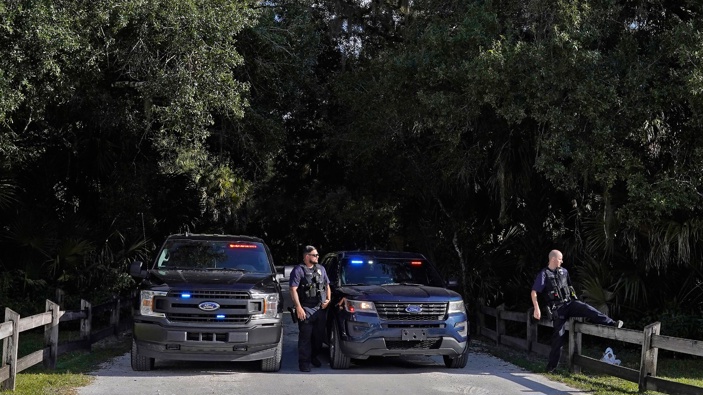 North Port police officers block the entrance to the Myakkahatchee Creek Environmental Park in Florida on Wednesday. (Photo / AP)