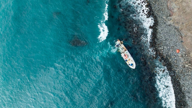 A fishing vessel has run aground at Shell Bay, Banks Peninsula, leaking oil into the area. Photo / George Heard