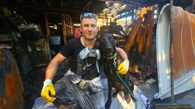 Peter Mckeenan and his dog, Moose, who saved him from a devastating fire.