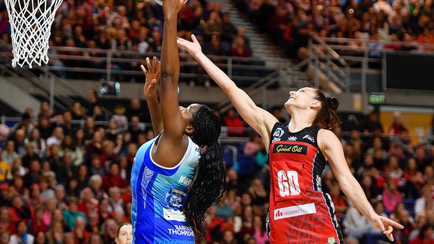 Grace Nweke of the Mystics collects the ball ahead of Karin Burger of the Tactix. Photo / Photosport