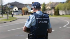A police officer in Havelock North after the kidnapping of two children in the town last October. Photo / Paul Taylor