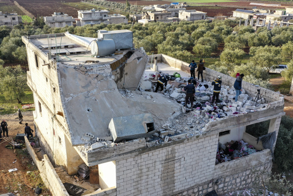 People inspect a destroyed house following an operation by the U.S. military in the Syrian village of Atmeh, in Idlib province. (Photo / AP)