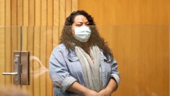 In the dock at the Whanganui District Court for financial crimes against two young relatives from Samoa, Faith Furean wore a mask because of a cough. Photo / Bevan Conley