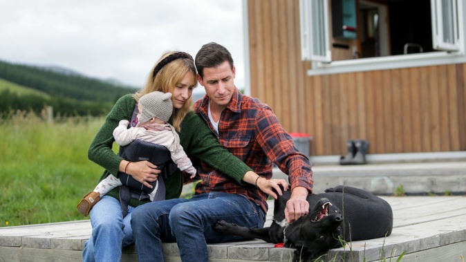 Eli Thomas and Sophie Annen with daughter Charlie-Rose fear they've lost about $350,000 paid to home builder Podular. Photo / Dave Lintott