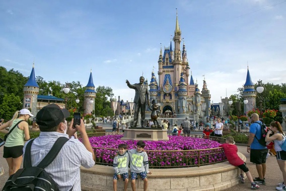 People visit the Magic Kingdom Park at Walt Disney World Resort in Lake Buena Vista, Fla., April 18, 2022. Ongoing strength at its theme parks and an improving streaming business propelled The Walt Disney Co. to higher profits and revenue in its fiscal second quarter in 2023. (AP Photo/Ted Shaffrey, File)