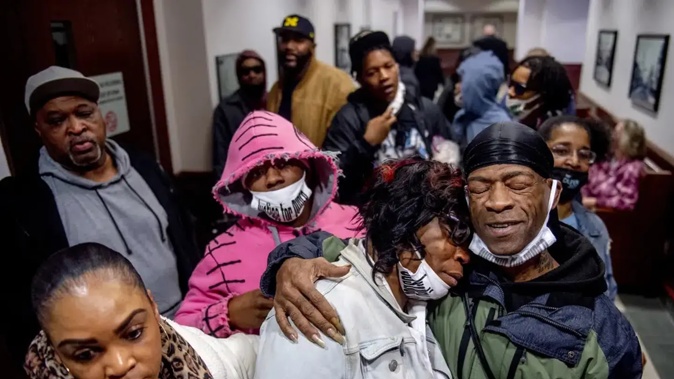 Calvin Munerlyn's family celebrates outside the courtroom after Sharmel Teague, her husband Larry Teague, and son Ramonyea Bishop, were sentenced in the fatal shooting of the security guard at a Family Dollar store in Flint, Michigan. Photo / AP