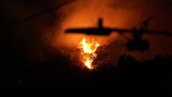 Firefighters battle to contain wildfires, which have scorched thousands of acres, destroyed homes, forced widespread evacuations across region in Los Angeles, CA, United States on January 12, 2024. (Photo by Lokman Vural Elibol/Anadolu via Getty Images)