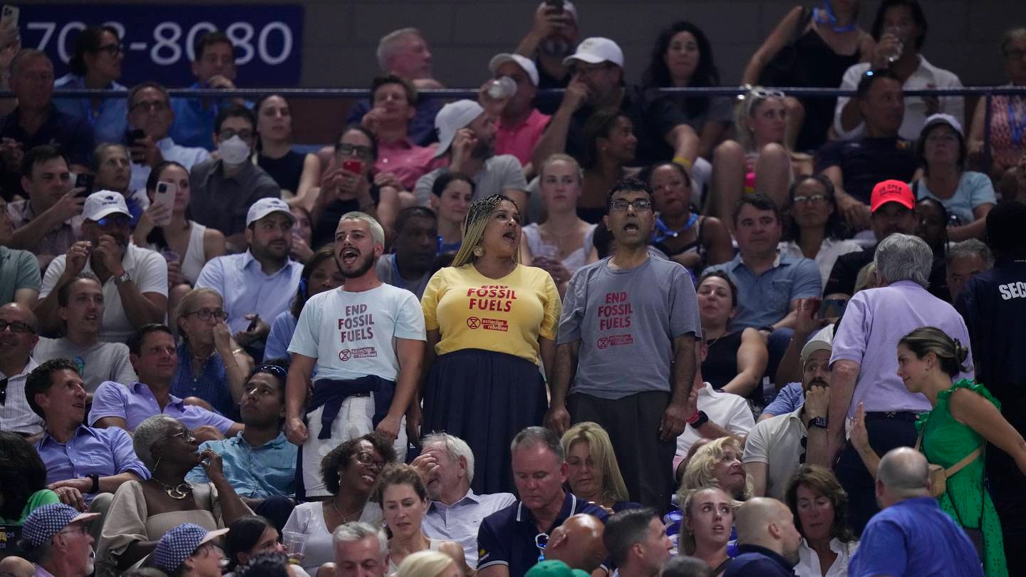 Protesters demonstrate at a match between Coco Gauff and Karolina Muchova at the US Open. Photo / AP