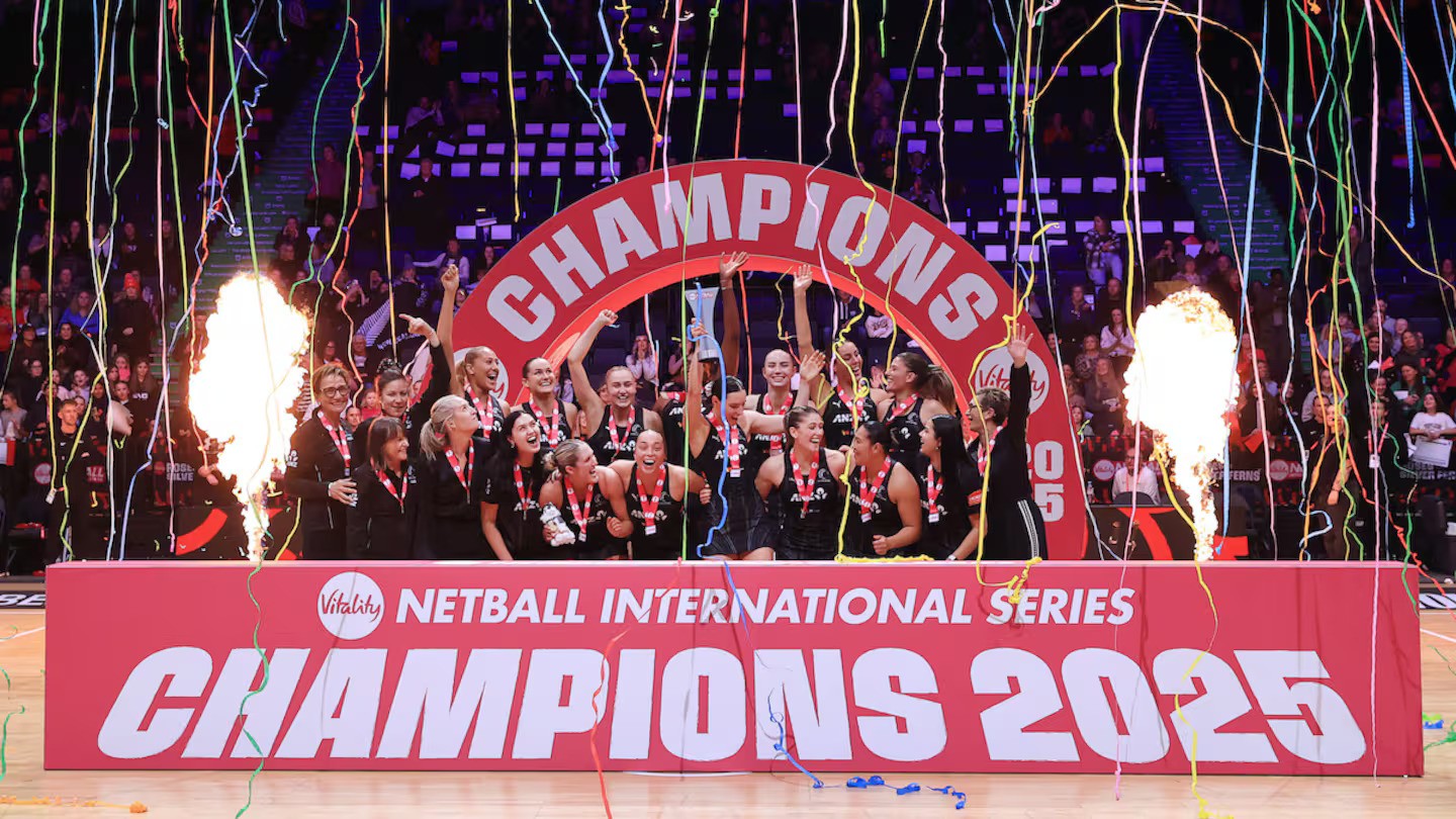 The Silver Ferns celebrate with the trophy after their series victory over England. Photo / Photosport