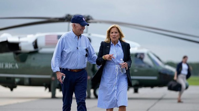 US President Joe Biden and First Lady Jill Biden walk to board Air Force One for departure from Gainesville Regional Airport after surveying damage caused by Hurricane Idalia. Photo / AP