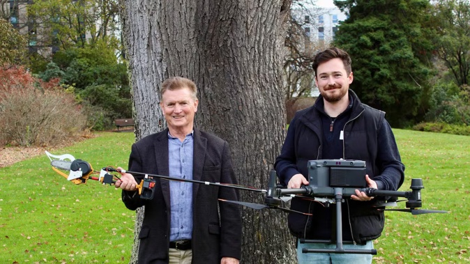 University of Canterbury computer science professor Richard Green (left), and UAV expert Dr Sam Schofield with their chainsaw drone. Photo / Sacha Skinner, University of Canterbury
