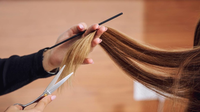 A young worker hired by a barber to sweep floors and make coffee also cut clients' hair. She has been awarded compensation after she challenged the nature of her employment. Photo / 123RF