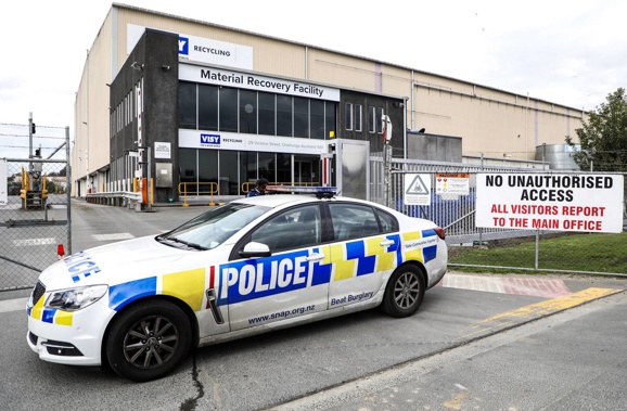 Police examine the VISY recycling facility on Victoria Road Onehunga where the body of the newborn baby was found. Photo / Hayden Woodward