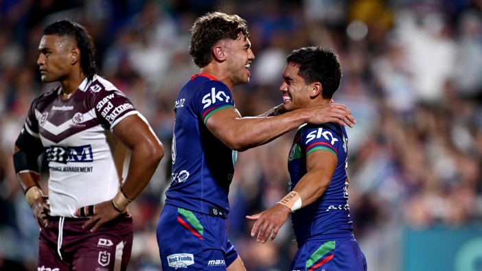 Taine Tuaupiki of the Warriors (R) celebrates his try with Chanel Harris-Tavita (L) during the round two NRL match between New Zealand Warriors and Manly Sea Eagles at Go Media Stadium, on March 14, 2025, in Auckland, New Zealand. (Photo by Hannah Peters/Getty Images)