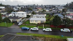 Armed police swarmed Glen Eden in West Auckland this morning to put in custody a parolee being returned to jail. The man was at a property in Selak Place. Photo / Supplied