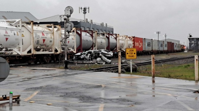 Lincoln Rd in Christchurch where a car was crushed by a train on a rail crossing. The car is believed to have been a stolen vehicle. No one was injured in the incident. Photo / Nathan Morton