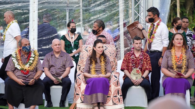 Prime Minister Jacinda Ardern (centre) in Sāmoa flanked by National Party leader Christoper Luxon (left) and Act leader David Seymour (right). Photo / Pacific TV