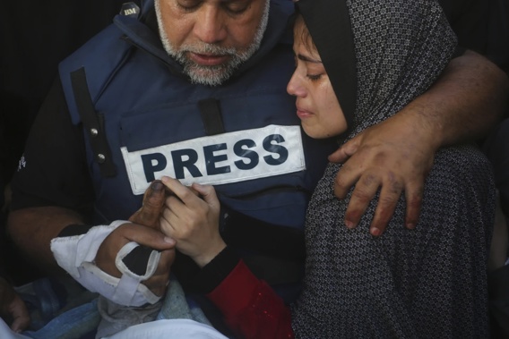 Al Jazeera journalist Wael Dahdouh holds the hand of his son Hamza, who also worked for Al Jazeera and wo was killed in an Israeli airstrike in Rafah, Gaza Strip, Sunday Jan 7 2024. Photo / AP