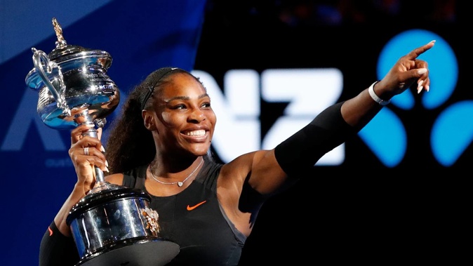 Serena Williams holds her trophy after defeating her sister Venus during the women's singles final at the 2017 Australian Open. Photo / AP