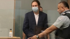 Xavier Valent enters the dock on the first day of his trial at the Auckland High Court. Photo / Michael Craig