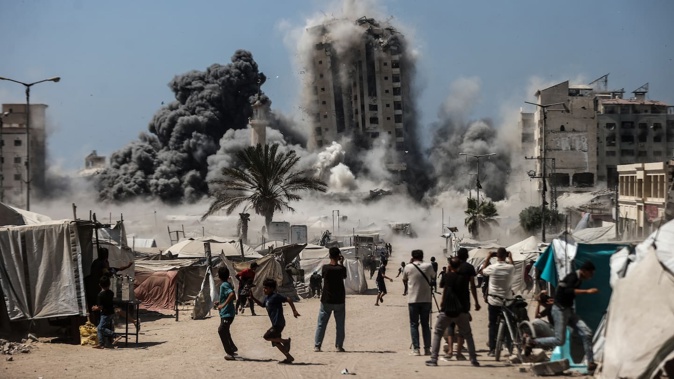 Israel’s Army has bombed three Gaza City residential towers in three days. Photo / Getty Images