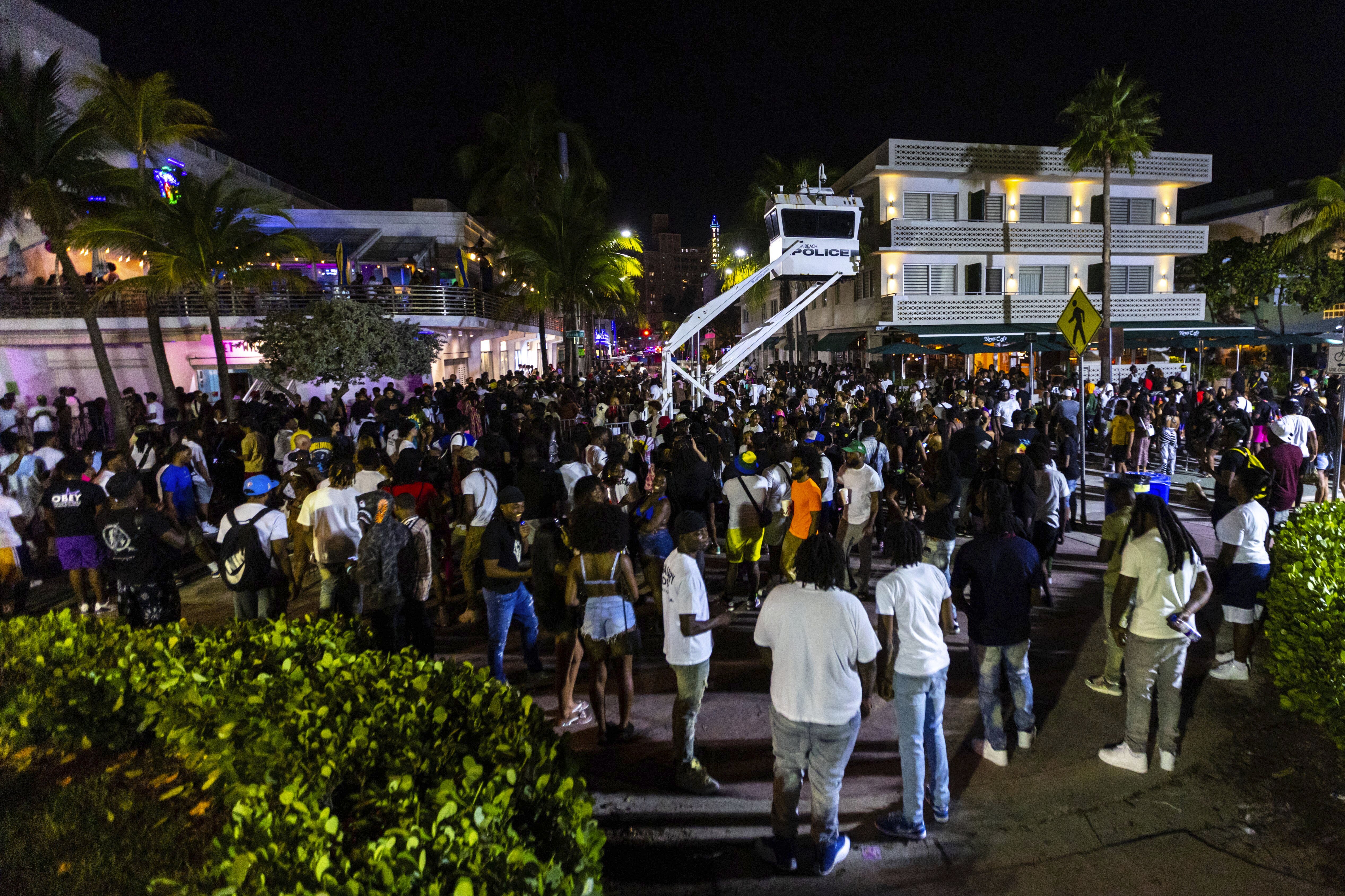 Crowds gather during spring break on Saturday, March 18, 2023, in Miami Beach, Fla. Miami Beach officials imposed a curfew beginning Sunday night, March 19, after two fatal shootings and rowdy, chaotic crowds that police have had difficulty controlling. Photo / AP