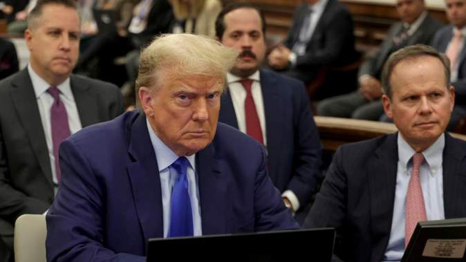 Former President Donald Trump, left, and his attorney Chris Kise. Photo / AP
