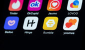 Dating apps can be seen on the display of an iPhone SE. Photo: Silas Stein/dpa (Photo by Silas Stein/picture alliance via Getty Images)
