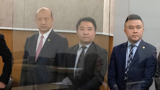 Businessmen Yikun Zhang, Hengjia (Joe) Zheng and Shijia (Colin) Zheng at their first court appearance in the Labour Party donations case. Photo / Jason Oxenham