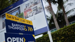 For sale signs outside a house in Auckland. Photo / Ted Baghurst