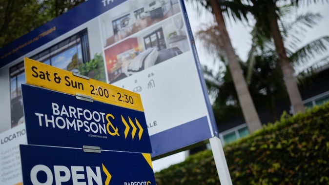 For sale signs outside a house in Auckland. Photo / Ted Baghurst