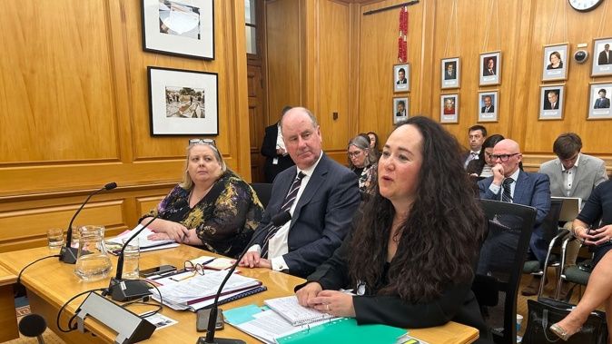 Oranga Tamariki deputy chief executive Tusha Penny (right) speaks to a Parliament select committee about the recent death of a participant in the Government's bootcamp pilot. Photo / Adam Pearse