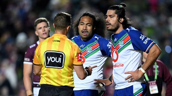 Referee Grant Atkins speaks with Bunty Afoa and Tohu Harris during a 2022 clash. Photosport