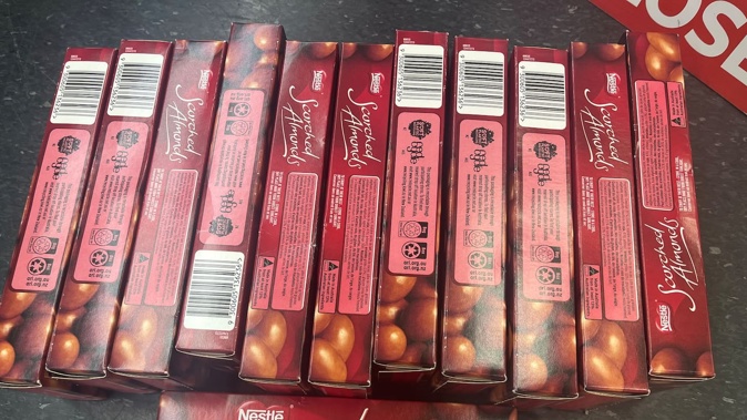 An Auckland woman was arrested after being caught shoplifting 12 boxes of Scorched Almonds from a Pakuranga Supermarket.