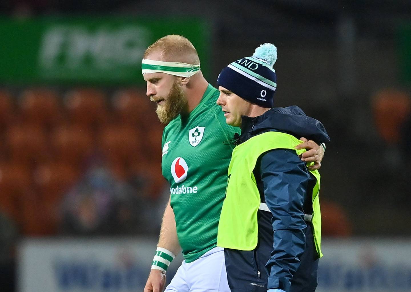 Jeremy Loughman of Ireland leaves the pitch with Ireland team doctor Ciaran Cosgrave. (Photo / Getty Images)
