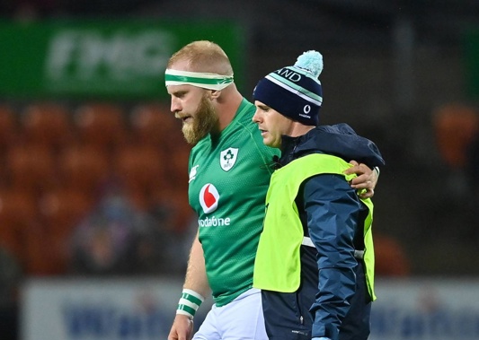Jeremy Loughman of Ireland leaves the pitch with Ireland team doctor Ciaran Cosgrave. (Photo / Getty Images)