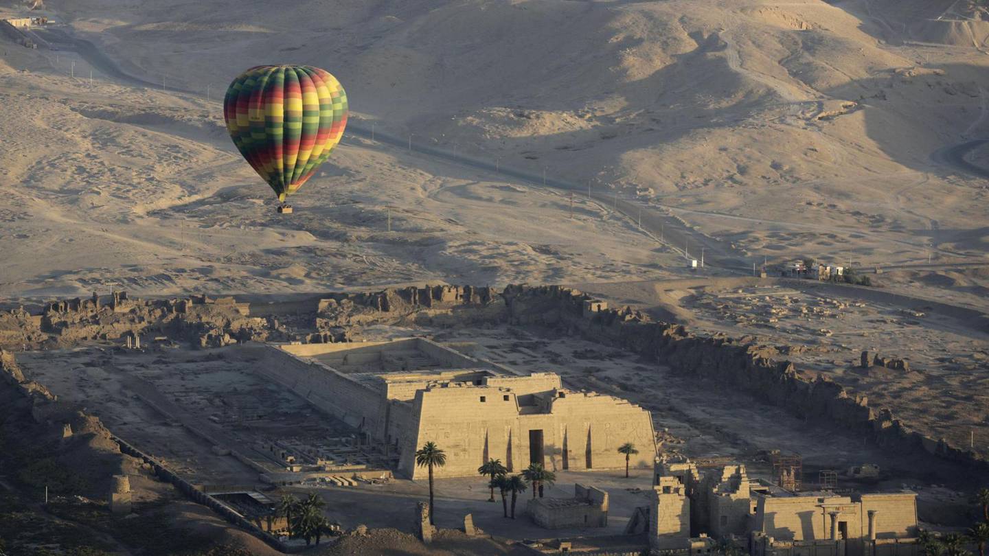A hot air balloon flies over the mortuary temple of Ramsis III in Luxor, Egypt. Photo / Amr Nabil, AP